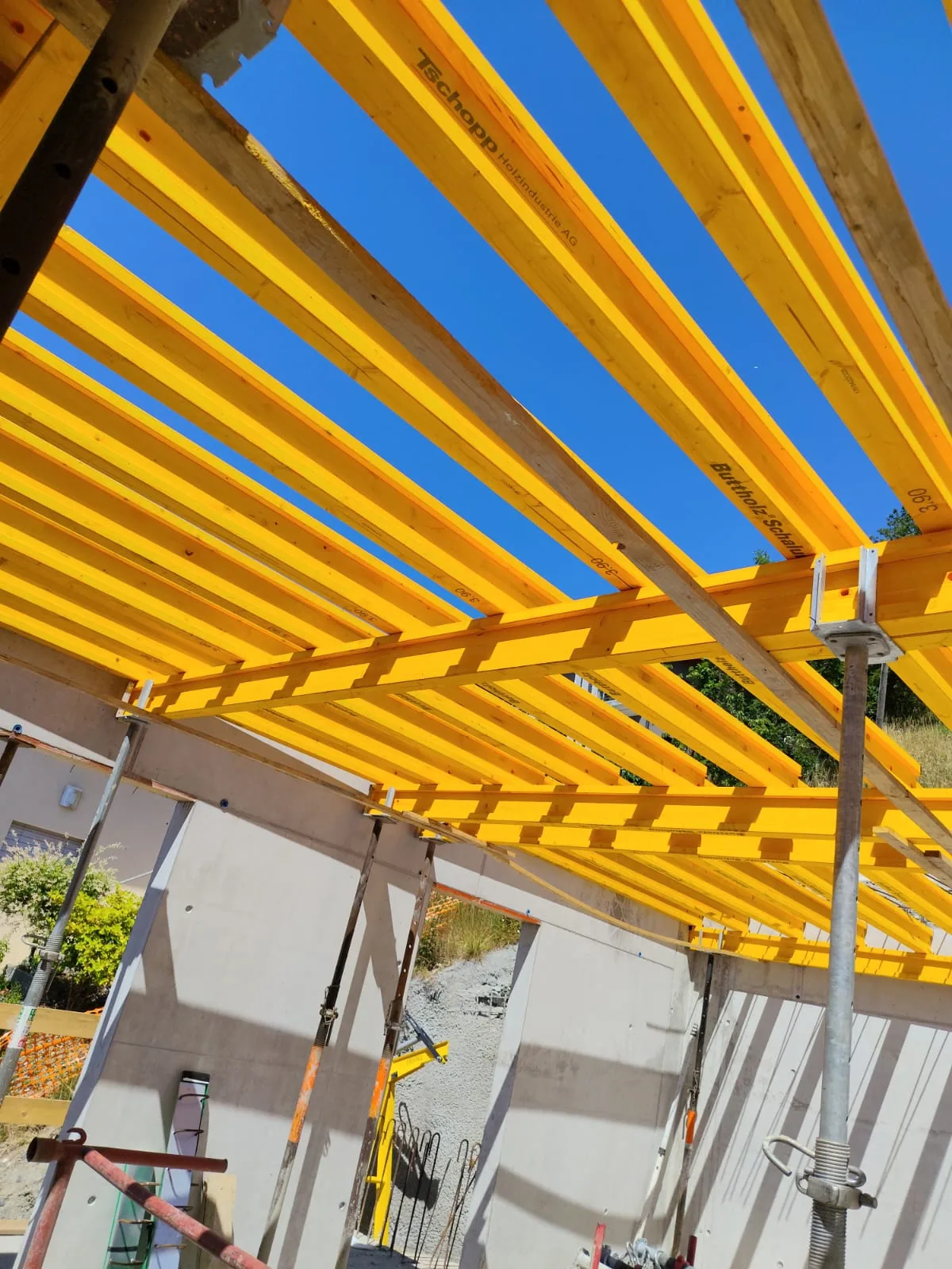 Timber beams of a roof structure under construction