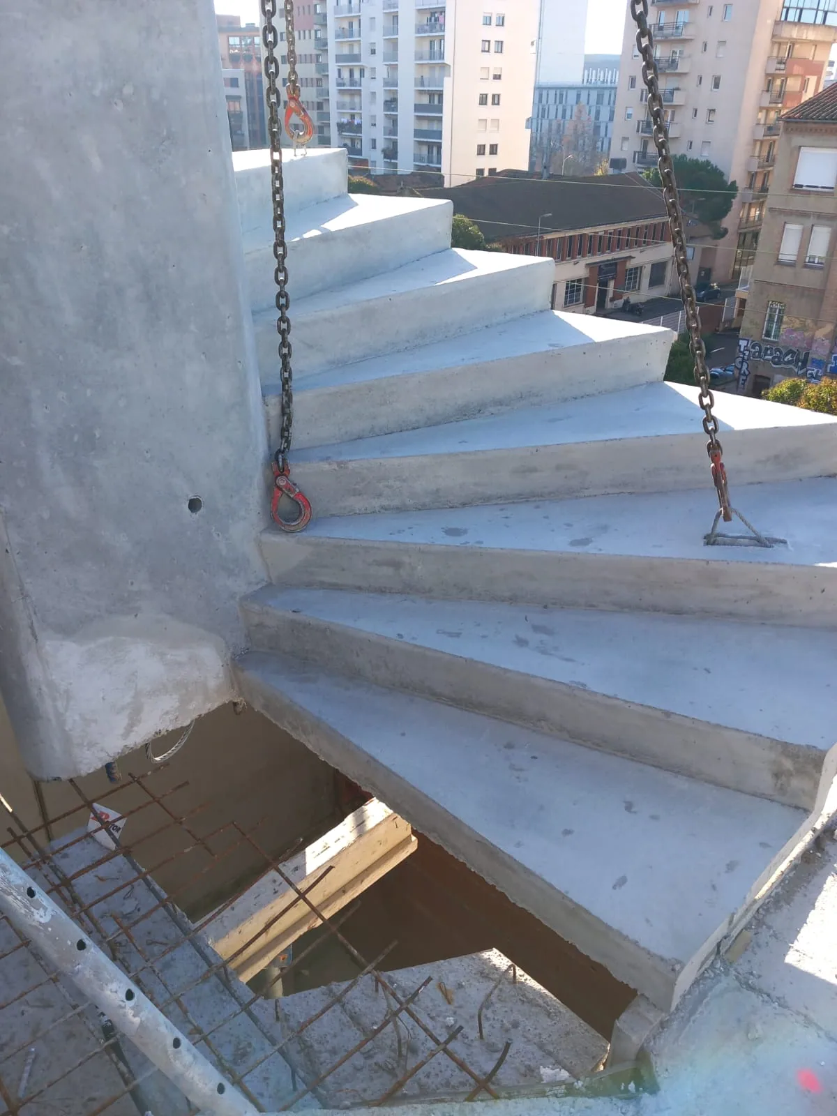 Concrete staircase suspended during structural work